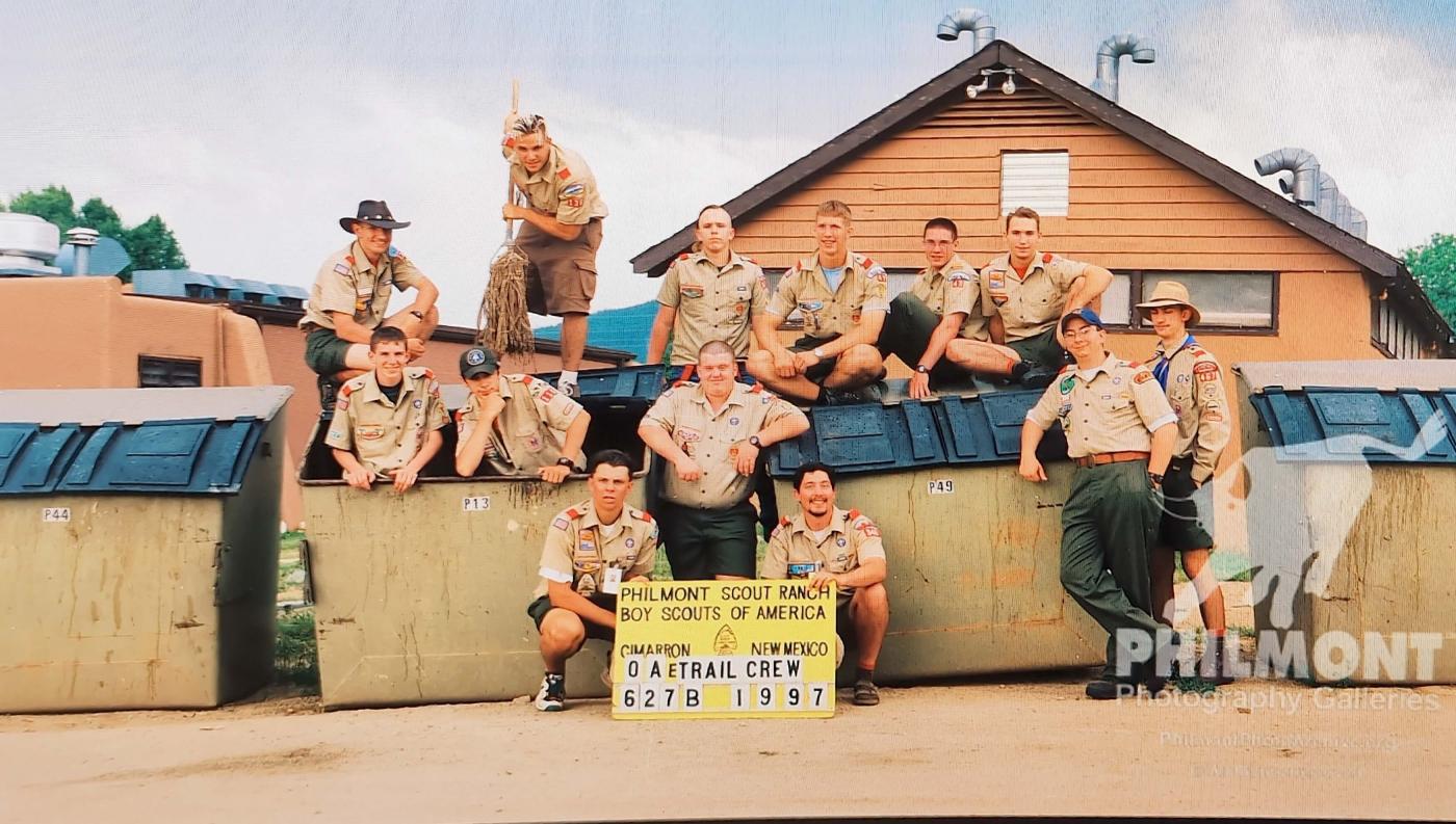 Matt and other Scouts at OATC, sitting on dumpsters