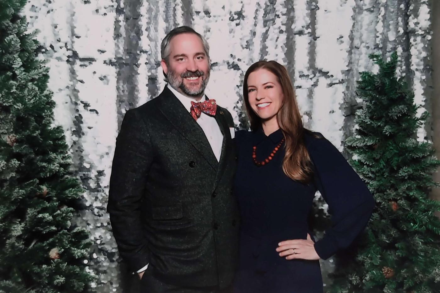 Matt and his wife at a holiday banquet